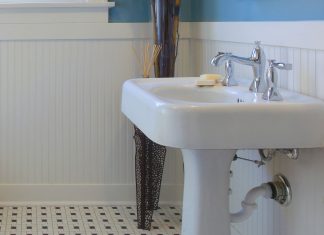 White cast iron sink in a mid-century modern bathroom