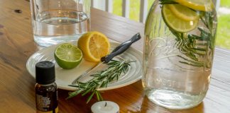 DIY mosquito repellant ingredients: lemon, lime, rosemary, oil, candle, water, mason jar