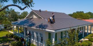 Workers installing a metal roof in Cut Off, Louisiana, on Today's Homeowner