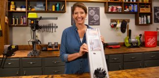 “Today’s Homeowner” Best New Products host Jodi Marks, displaying the Everbilt duct cleaner in her workshop