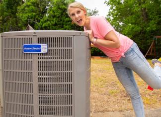 “Today’s Homeowner” co-host Chelsea Lipford Wolf leaning against her new American Standard HVAC unit
