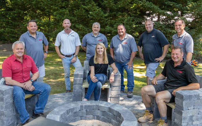 “Today’s Homeowner” hosts Danny Lipford and Chelsea Lipford Wolf, pictured with the Pavestone team, in Glassboro, New Jersey