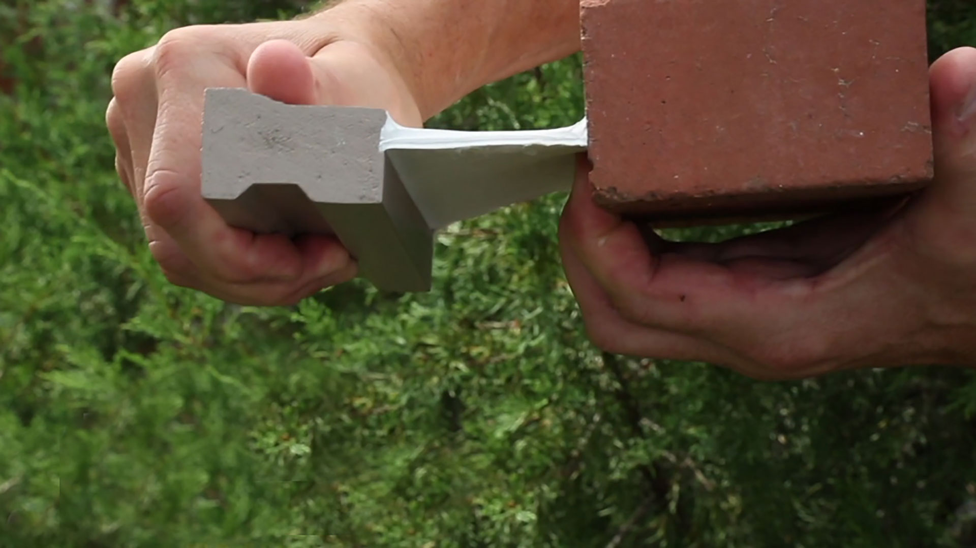 Titebond DuraMaster High Performance Sealant, seen sticking between a brick and a piece of molding