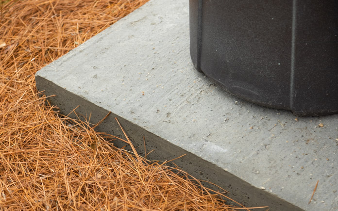 Concrete slab for garbage cans.
