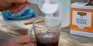 Baking soda pouring into soil mix