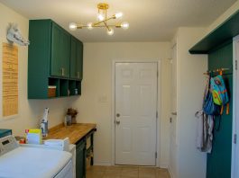 Laundry room with cabinets, butcher block counter top, beadboard