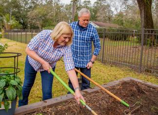 “Today’s Homeowner” host Danny Lipford and wife Sharon tend to a raised garden bed in Alabama.
