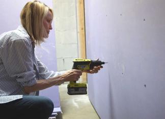 Woman installs National Gypsum's SoundBreak XP drywall at her Georgia townhome.