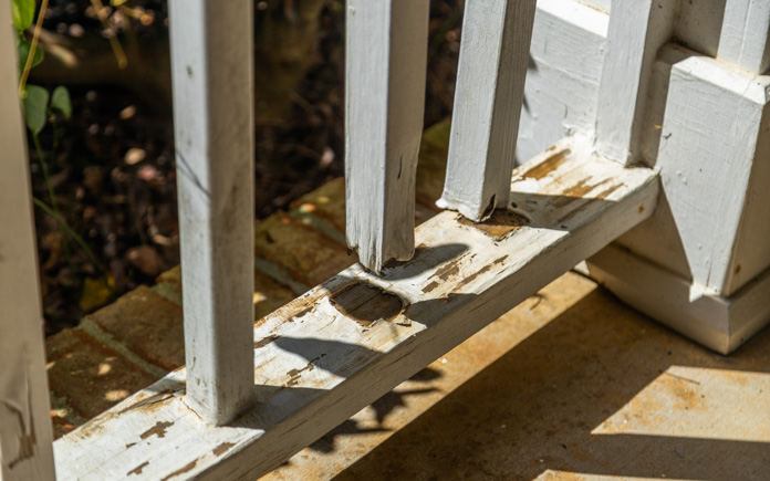 Rotting wood front porch balusters