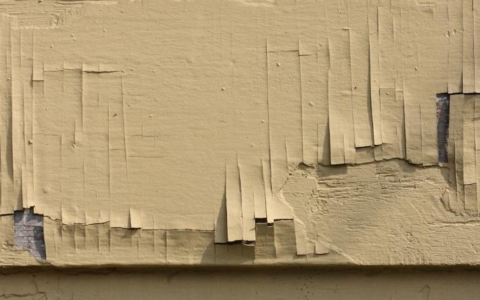 Paint peeling from wood siding