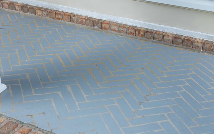A stenciled pattern hides imperfections and gives your porch a new feel.