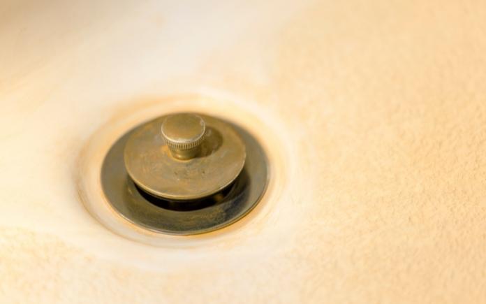 Tub drain with hard water stain