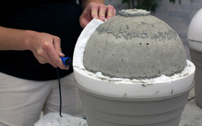 Removing foam from a concrete garden sphere 