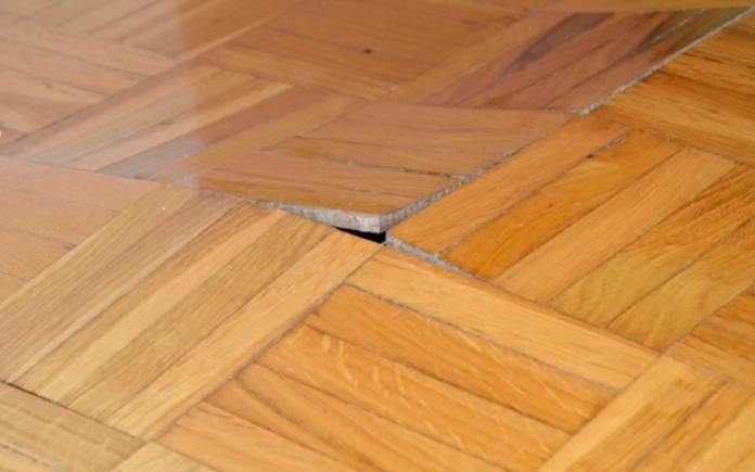 Ruined wooden floor by moisture and water