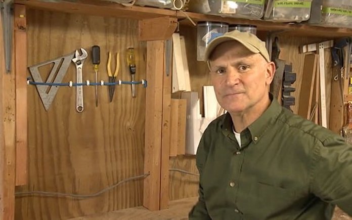Joe Truini next to his bungee cord tool storage Simple Solution