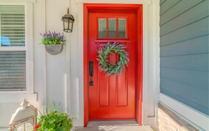 Red front door with wreath