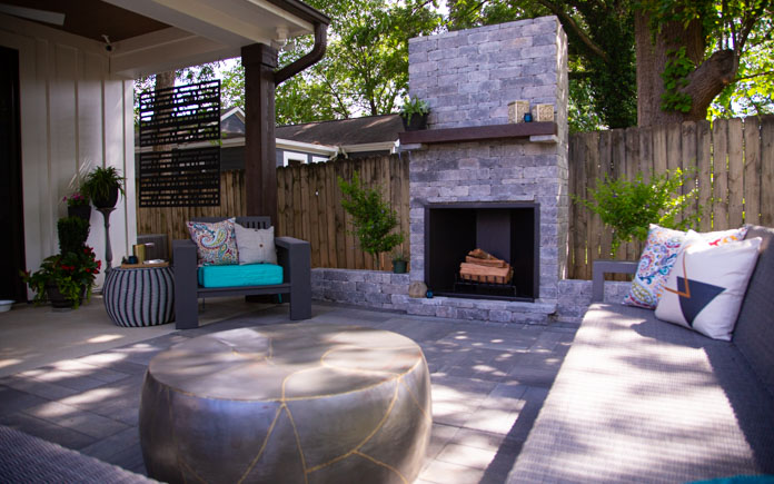 Outdoor fireplace made with Pavestone Rumblestone Grey