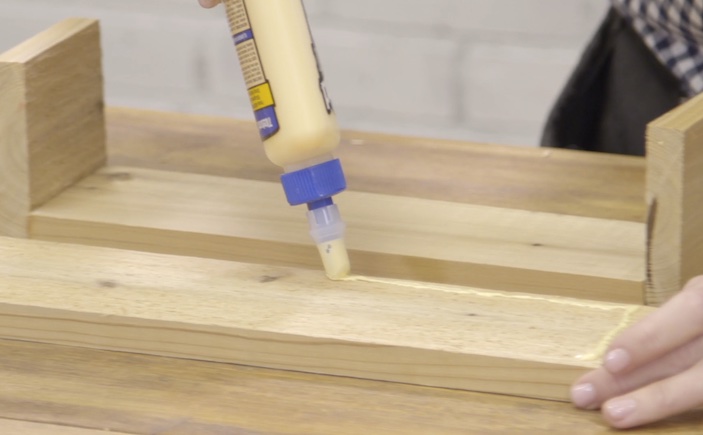 Applying Titebond wood glue to a planter box