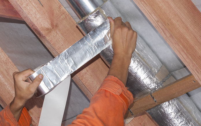 the installer wraps the air duct with mineral wool and foil