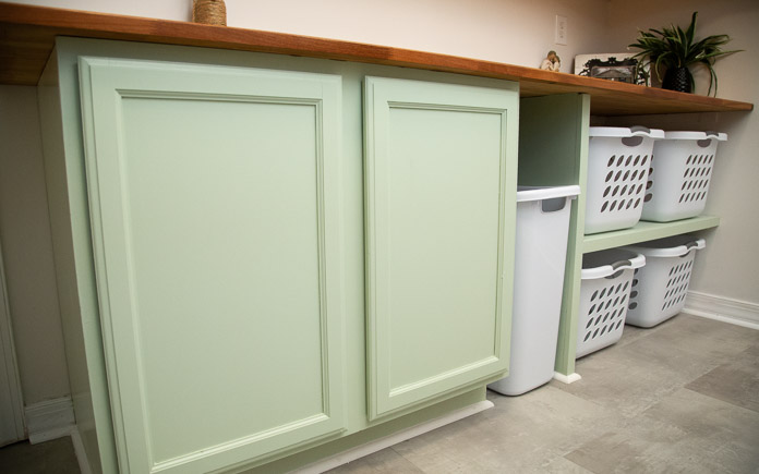 Laundry room cabinet with countertop and cubbies for baskets