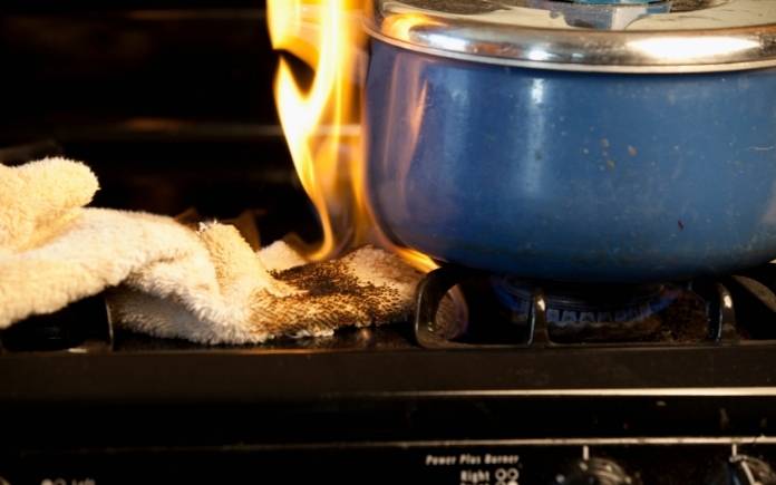 Towel accidentally catches fire on stove