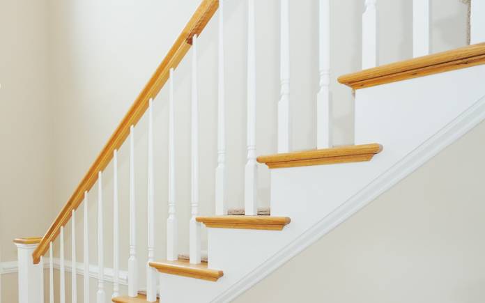 White stair spindles with wood railing and treads