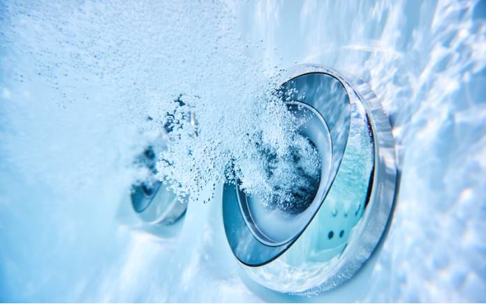 closeup of water jet in whirlpool tub