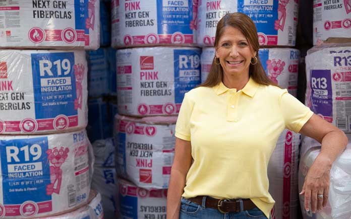 Best New Products host Jodi Marks stands in front of Owens Corning Next Gen Pink Fiberlgass Insulation at The Home Depot