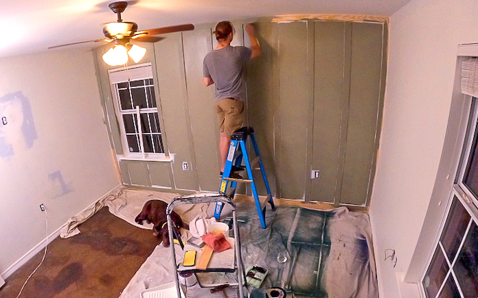Today's Homeowner Radio Producer Corey Wilson paints a board and batten wall