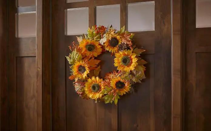 Home Accents Holiday 22 in Unlit Artificial Sunflower and Pinecone Harvest Fall Wreath on a wood front door