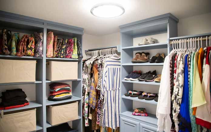 Custom closet system consisting of shelves, rods and a cabinet