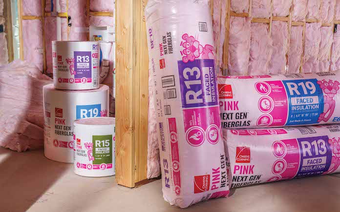 Rolls of Owens Corning PINK Next Gen Fiberglas Insulation inside a home that's under construction