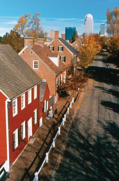 A historic streetscape in the village, with the Winston-Salem central business district in the background. (Photos: Courtesy Old Salem Museums & Gardens)